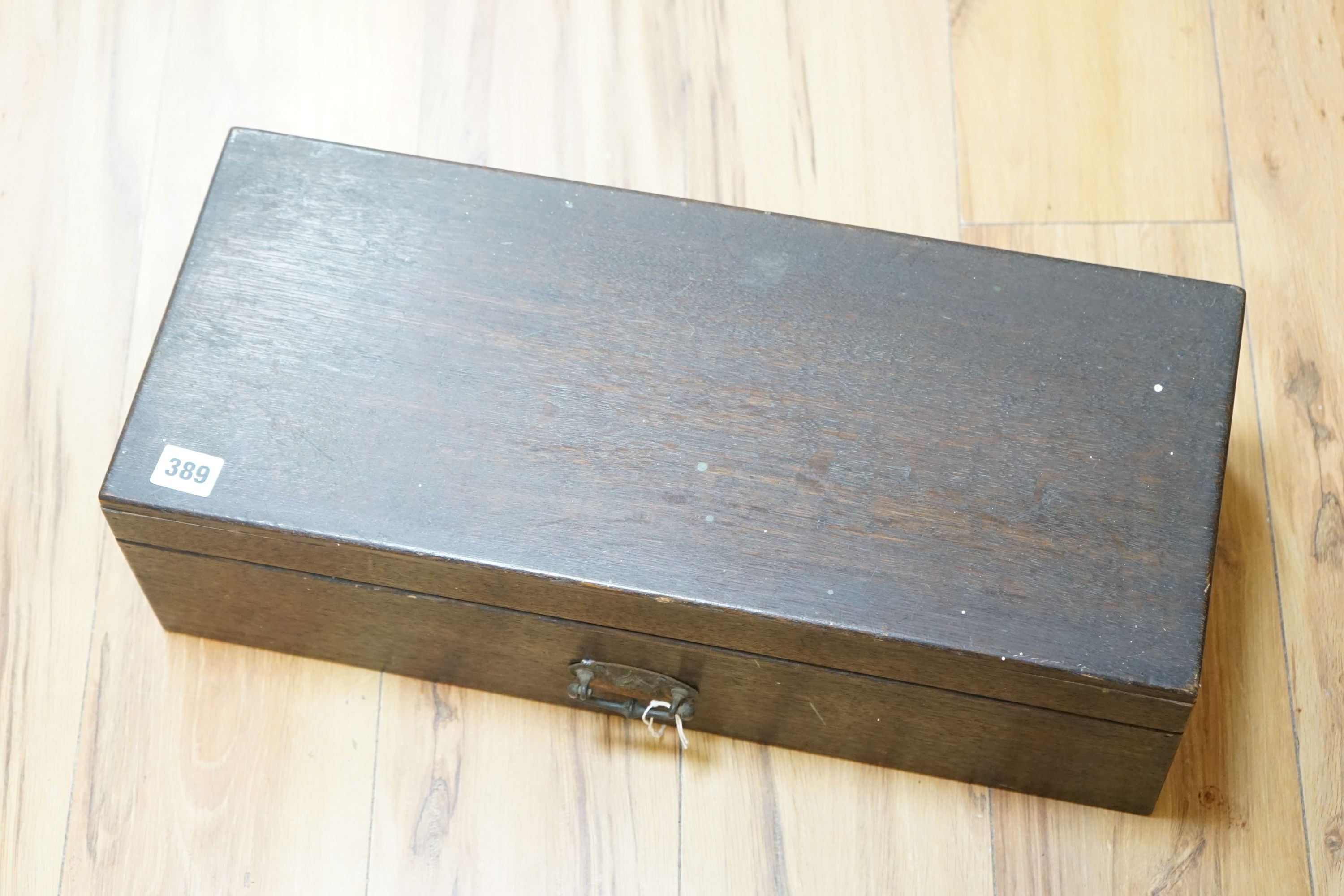 A 19th century oak box with embossed Art Nouveau copper handle, length 53cm